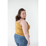 Person rocking a Mustard Yellow Mom Tank Top with blue jeans, perfect for stylish womens clothes