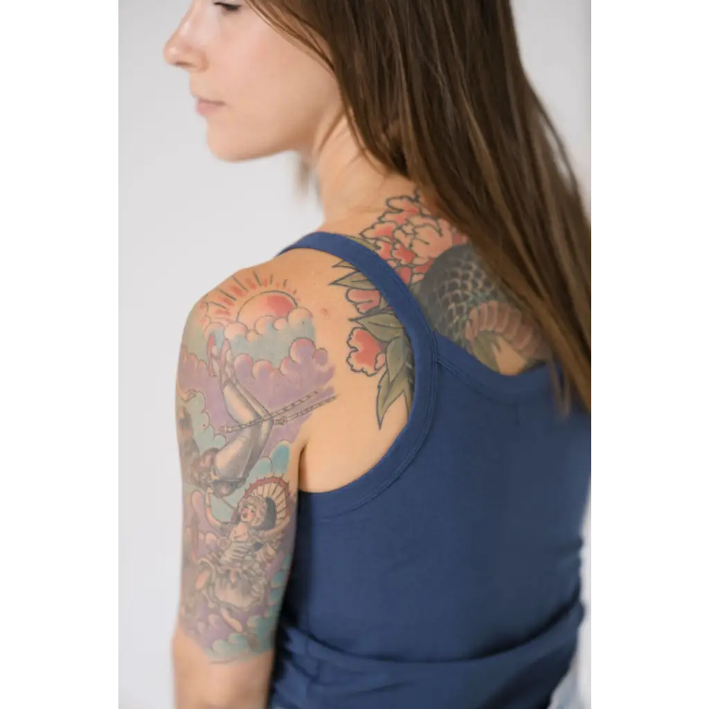 Colorful floral sleeve tattoo with Navy Transitional Mom Tank Top showcasing recommended sizing