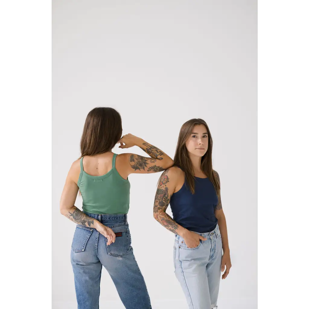 Two tattooed friends rock Navy Transitional Mom Tank Tops with recommend sizing style