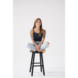 Black wooden bar stool with footrest, perfect for your Navy Transitional Mom Tank styling