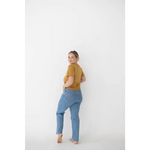 Light blue distressed jeans with straight-leg cut styled with Versatile Mom Tee in Organic Cotton Spandex Blend