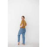 Light blue distressed jeans with straight-leg cut styled with Versatile Mom Tee in Organic Cotton Spandex Blend