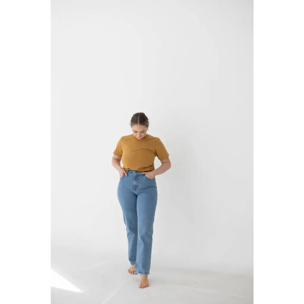 Light blue high-waisted jeans with a mustard yellow mom tee in organic cotton spandex blend