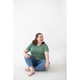 Person in a green mom tee made of organic cotton and spandex blend, comfy vibes