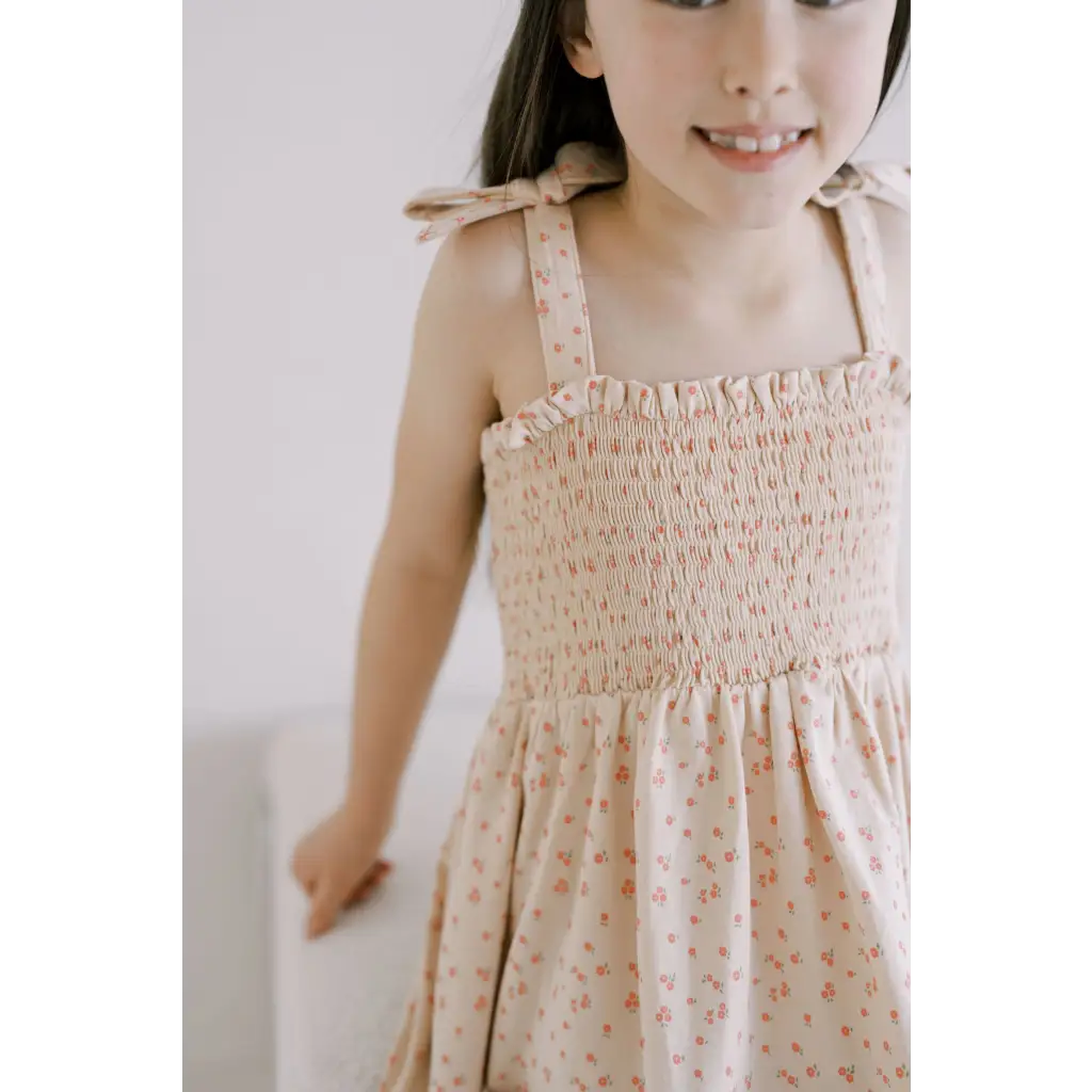 Floral smock dress in beige with tie straps, perfect mini play dress for kids