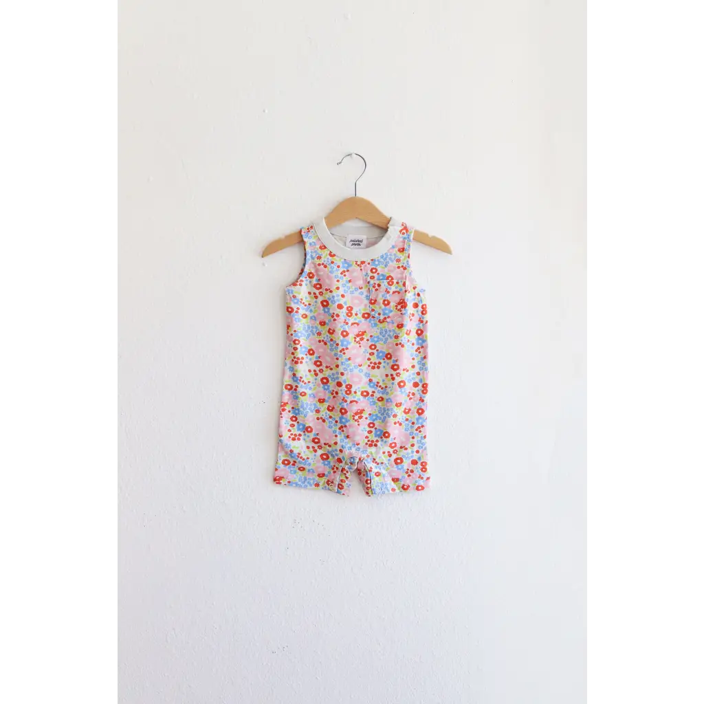 Floral sleeveless romper on wooden hanger, perfect super soft organic cotton pocket playsuit
