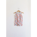 Floral sleeveless romper on wooden hanger, perfect super soft organic cotton pocket playsuit