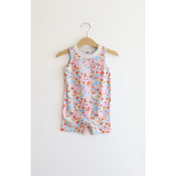 Floral sleeveless romper on a wooden hanger for toddlers in super soft organic cotton