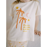 White T-shirt featuring orange palm trees and cool text design for sun moon vibes