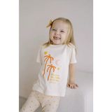 Joyful child in white t-shirt with orange palm trees, perfect for sun moon lovers!