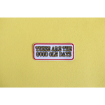 Retro iron-on patch with text celebrating the good ole days in vibrant style