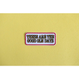 Retro iron-on patch with text celebrating the good ole days in vibrant style