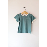 Sage Green Unhinged Ringer Tee for Kids in Organic Cotton on a hanger with white trim