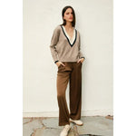 Woman in beige Varsity Contrast Deep V Neck Sweater with stylish womens clothes