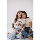 Two friends in ripped jeans and casual tees rocking the Strangers Ringer Tee together