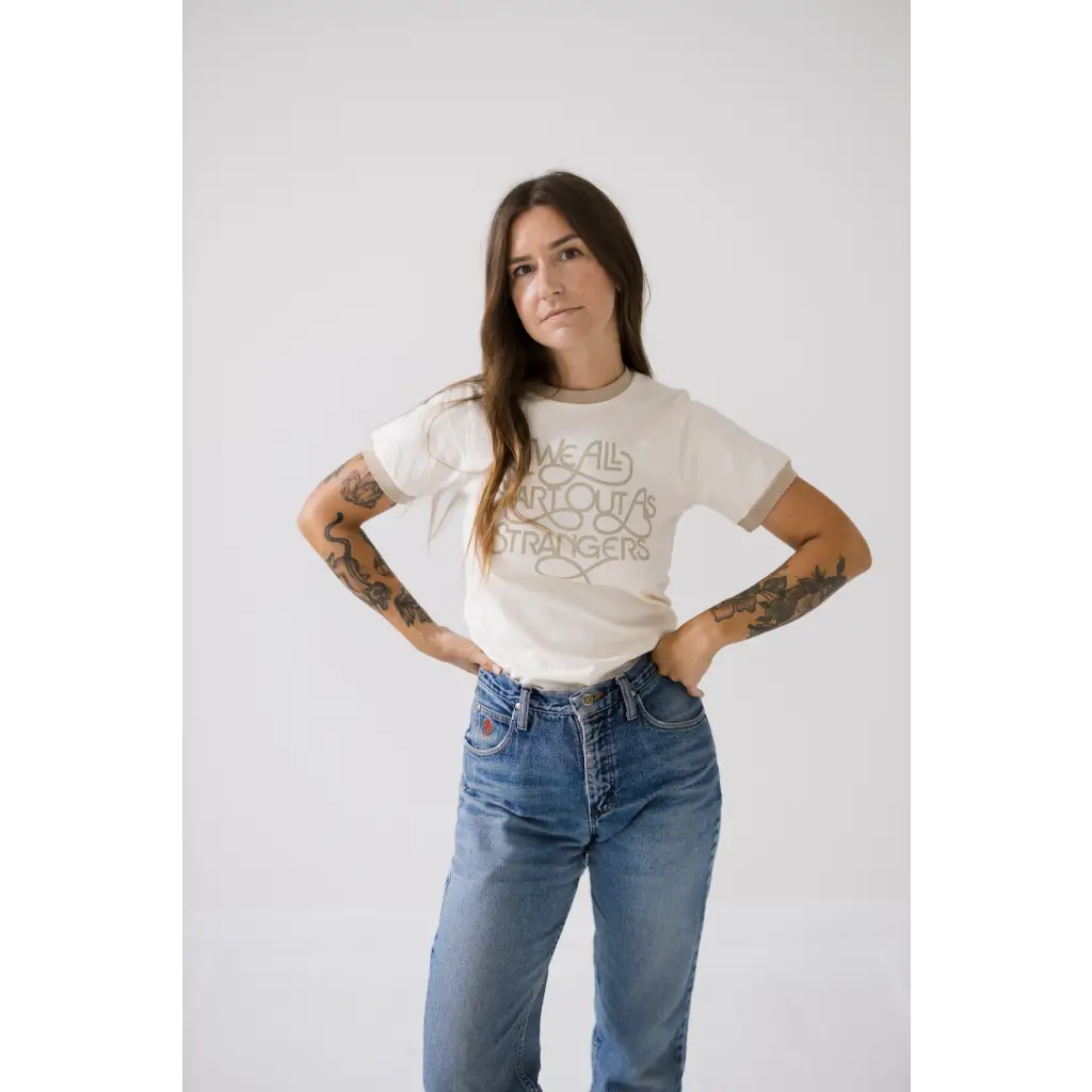 Strangers Ringer Tee in white with classic blue jeans for a chill casual vibe