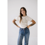 Strangers Ringer Tee in white with classic blue jeans for a chill casual vibe