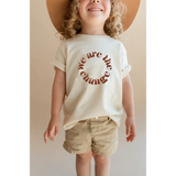 White organic cotton kids graphic tee featuring polished prints with We are the change design