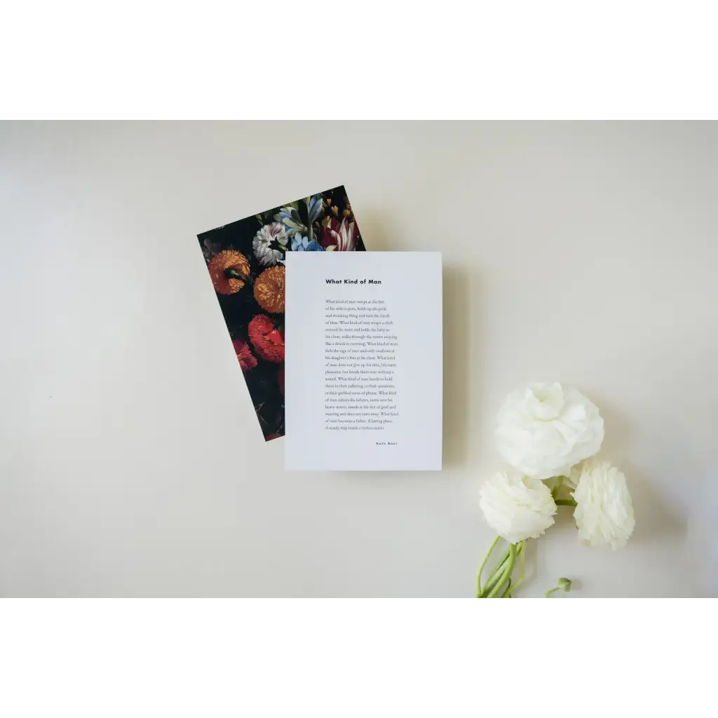 Two books with floral art and poetry excerpts beside white flowers, with free shipping