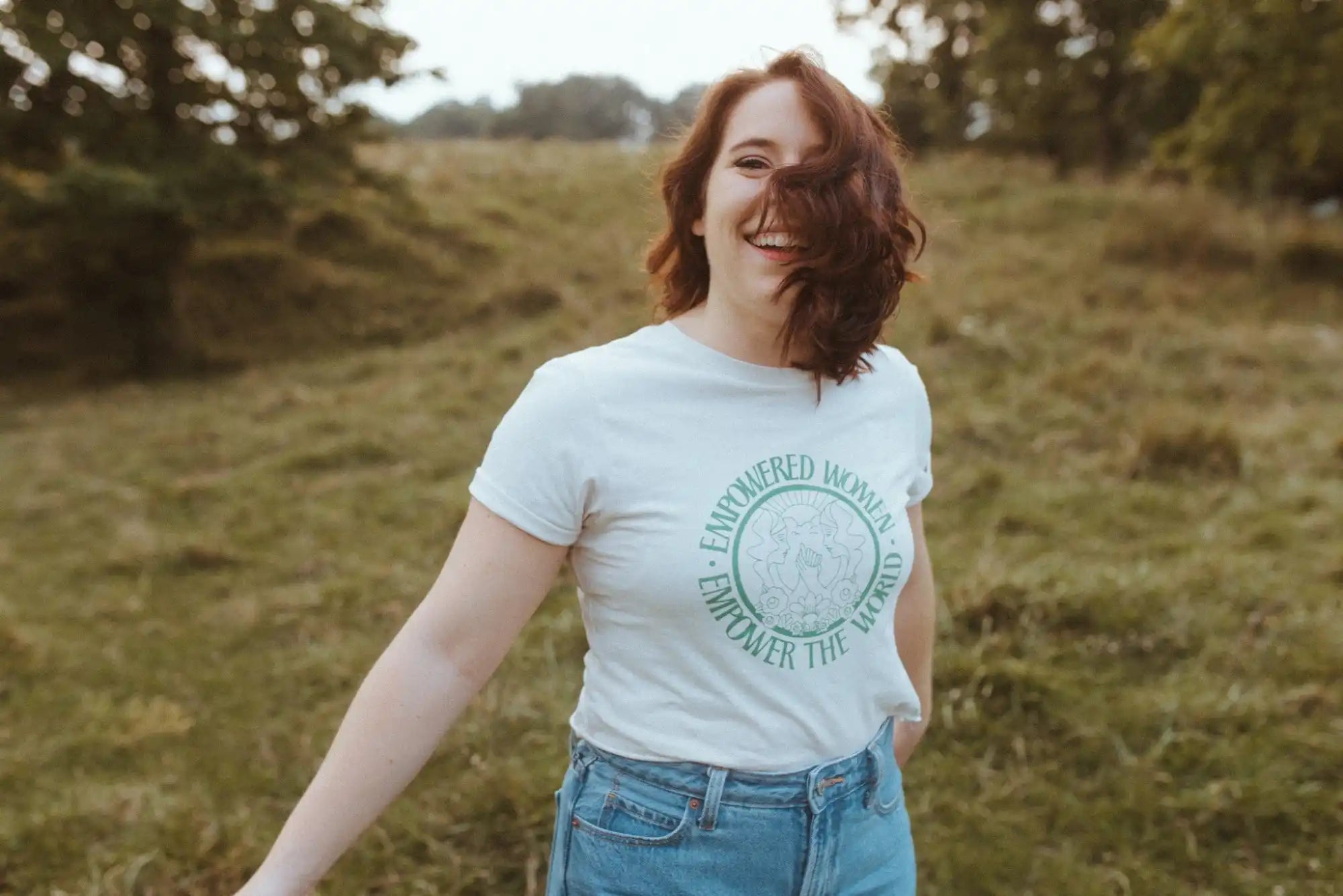 White t-shirt with ’Empowered Women Empower the World’ text.