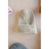 Cream-colored ribbed knit beanie with folded brim from our super soft small collection