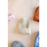 Cream-colored ribbed knit beanie from our Small Collection, super soft and stylish