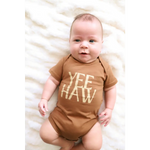 Brown organic cotton baby onesie with Yee Haw text for little cowboys and cowgirls
