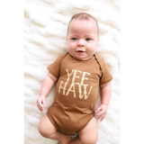 Brown organic cotton baby onesie with Yee Haw text for little cowboys and cowgirls
