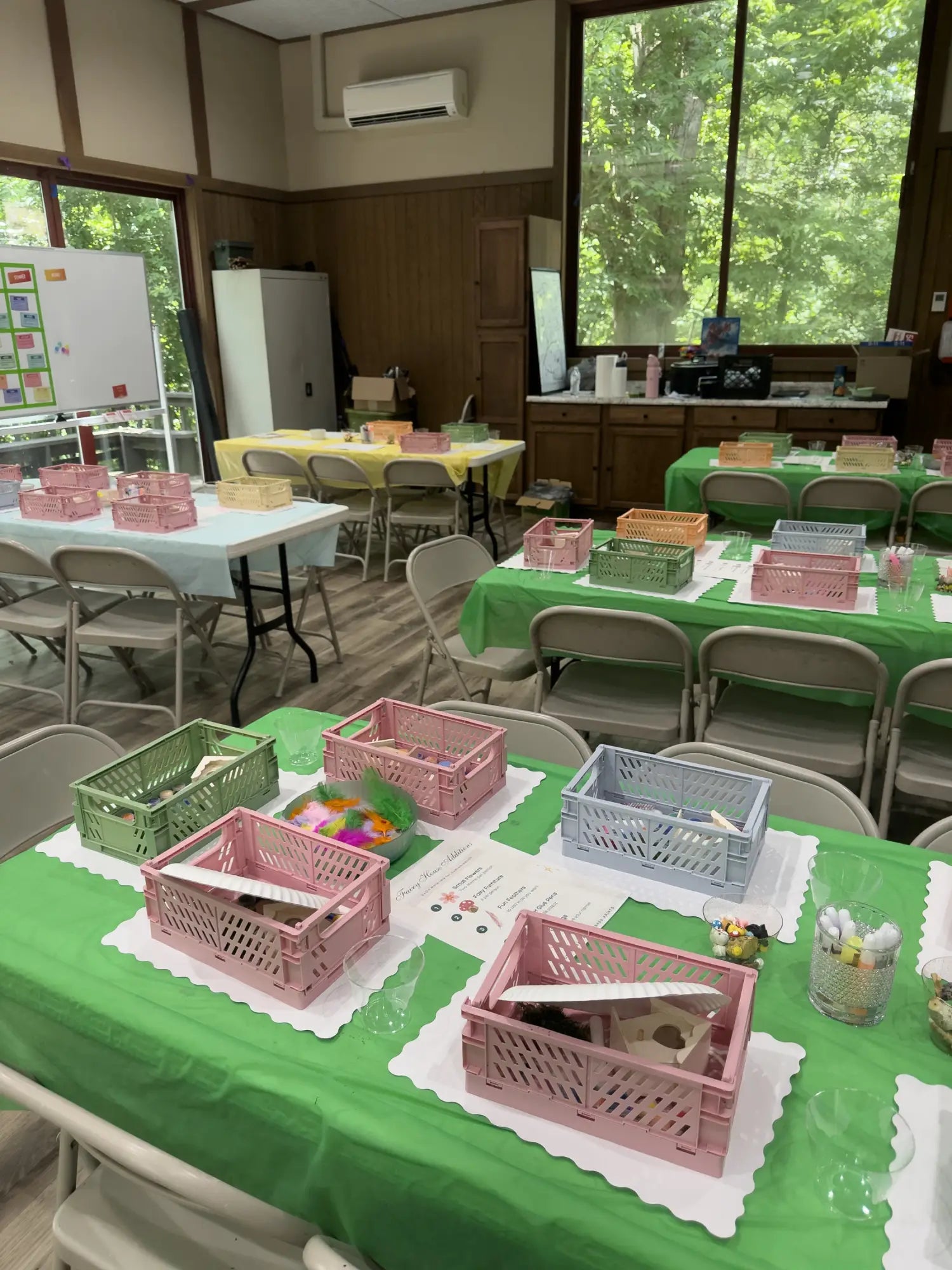Green tablecloth with scalloped edges and white placemats from Polished Prints for birthday parties