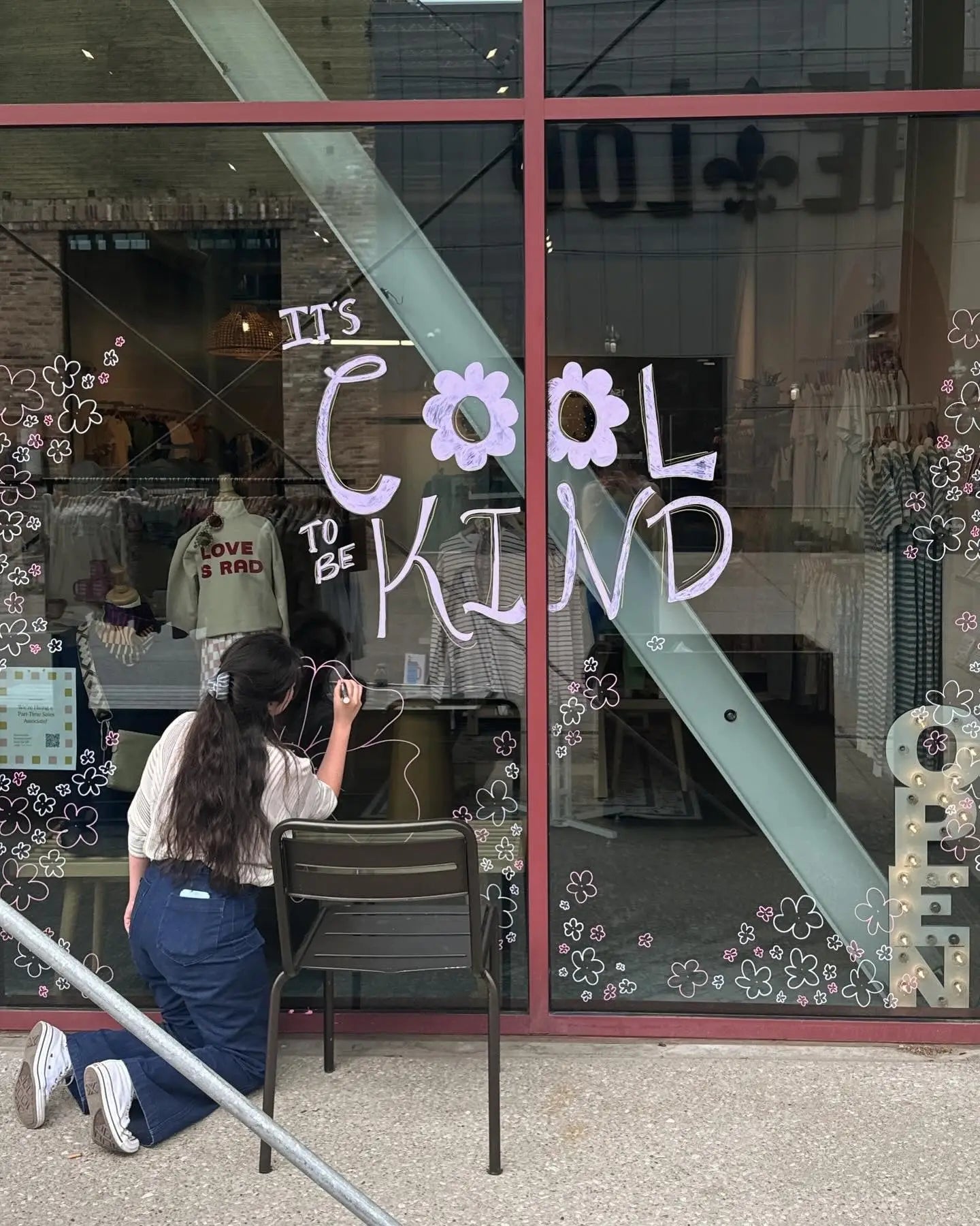 Window display with Cool Kind text and flowers from a couple weeks ago on a Saturday night shift.