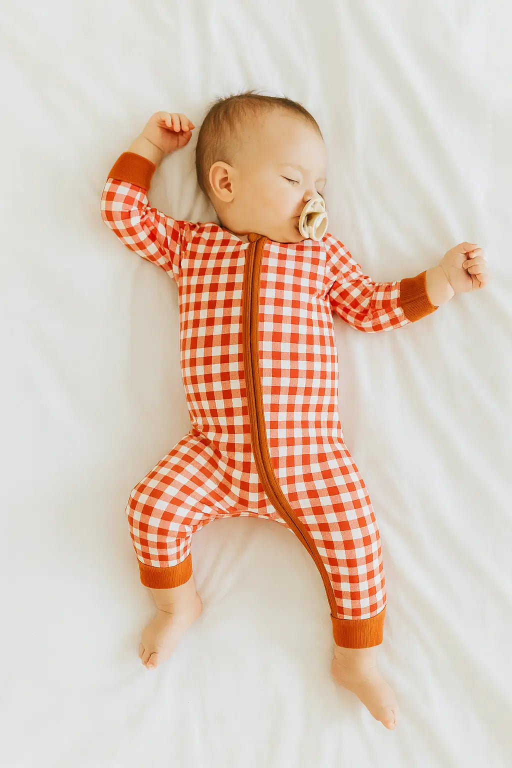 Red and white gingham baby onesie with brown trim from Fresh Digs polished prints collection