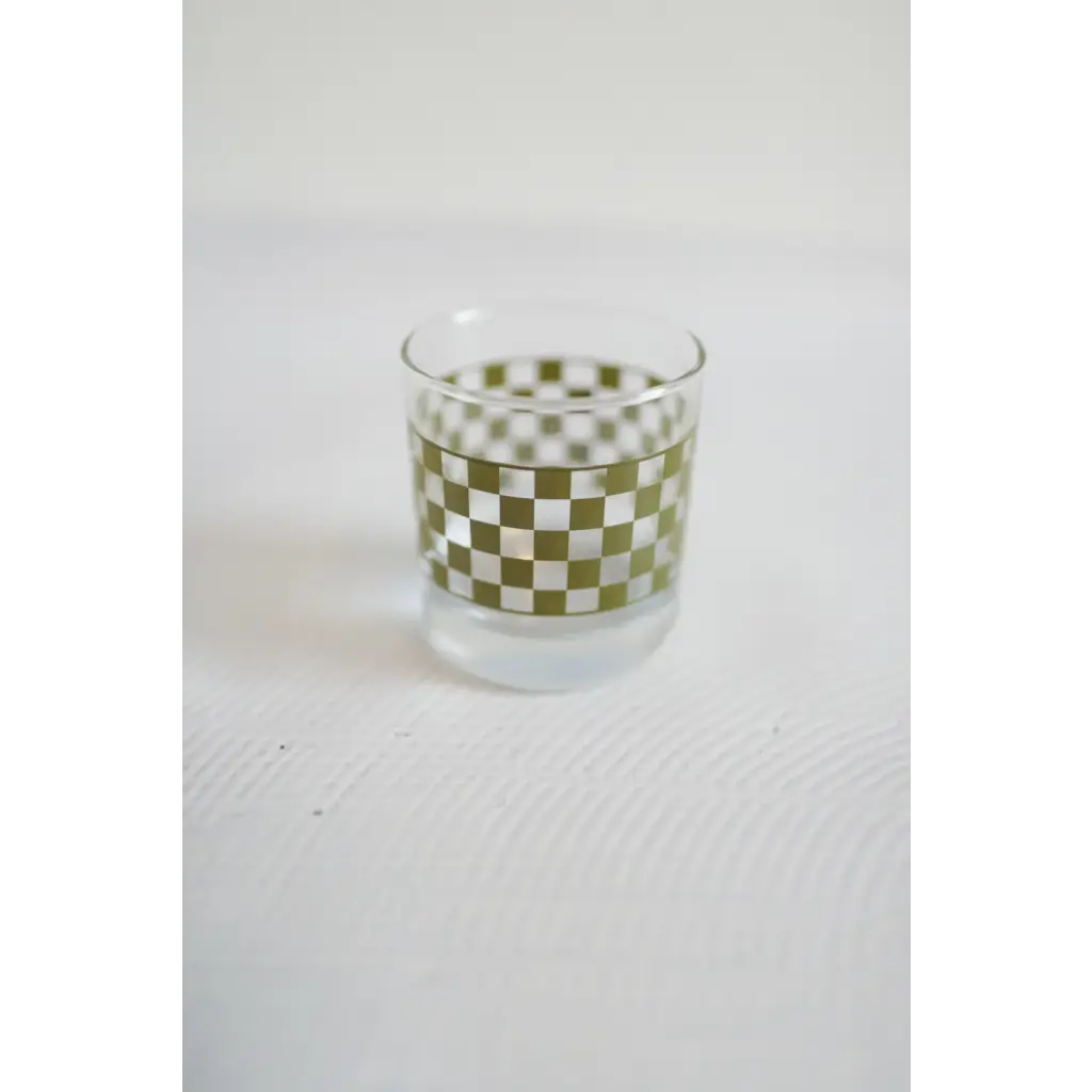 Glass tumbler with a green and white checkerboard pattern perfect for fun cocktails