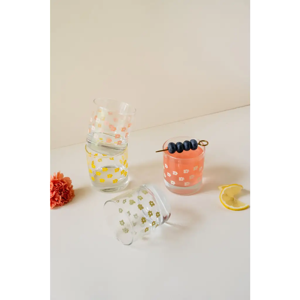 Colorful heavy-based 11oz checkered cocktail glass with citrus and olives