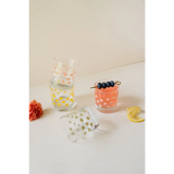 Colorful heavy-based 11oz checkered cocktail glass with citrus and olives
