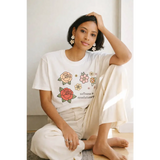 Oversized unisex tee with cotton comfort floral print and Softness is Revolutionary text