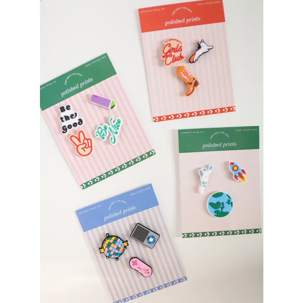 Charming 90s Nostalgia Clog Charm Set showcasing fun enamel pins on retail cards