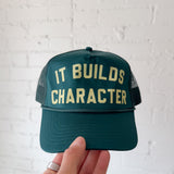 It Builds Character Trucker Hat