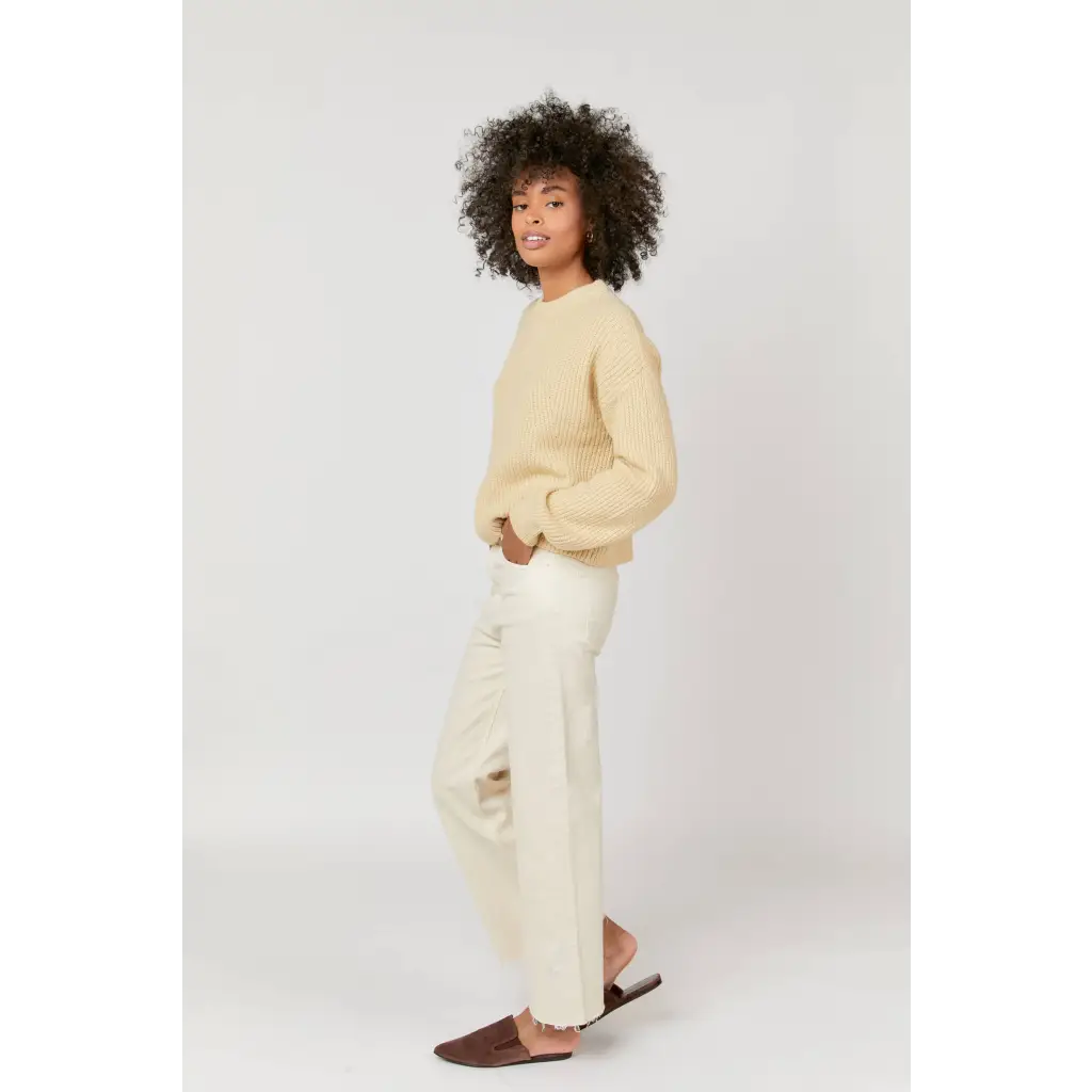 Cream-colored cropped sweater with high rise ecru jeans, stylish womens clothes