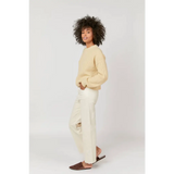 Cream-colored cropped sweater with high rise ecru jeans, stylish womens clothes