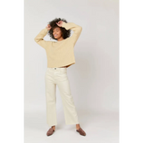 Cream cropped sweater with high rise white wide-leg pants for stylish womens clothes