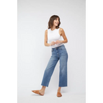White sleeveless tank with high neckline and cropped hem over Aberdeen high rise vintage worn jeans