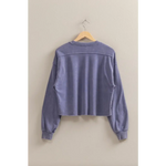 Cropped lavender sweatshirt hanging on a hanger, perfect stylish womens clothes for moms