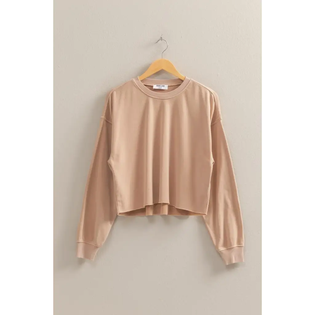 Beige cropped sweatshirt on a hanger, perfect for stylish womens clothes and polished prints