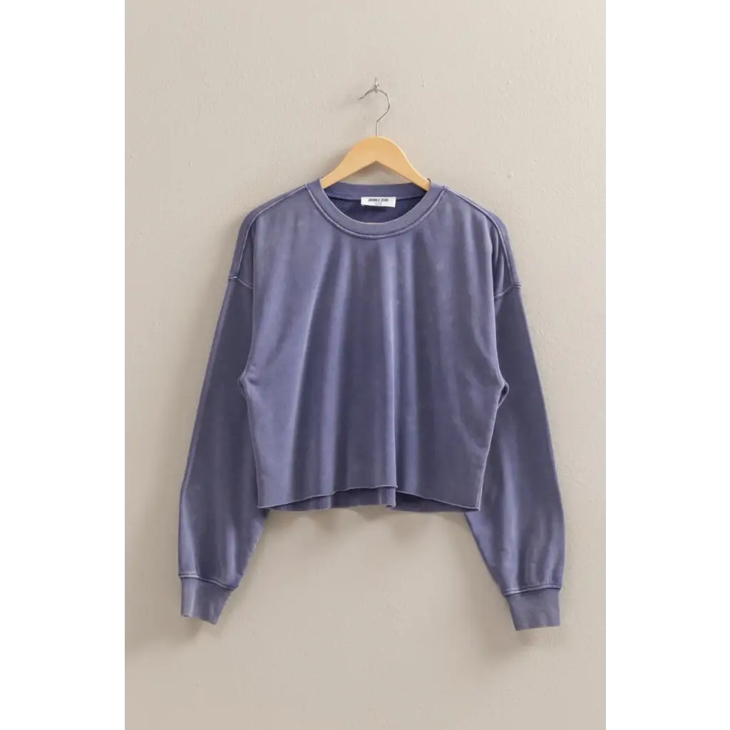 Dusty blue cropped sweatshirt on hanger, perfect stylish womens clothes for casual wear