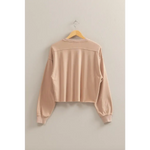 Beige cropped sweatshirt on a hanger, perfect for stylish women’s clothes and moms