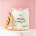 White candle in a glass jar with funny label for average pickleball players creating small batches