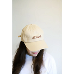 Beige embroidered baseball hat with all is well text perfect for casual vibes