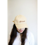 Beige embroidered baseball hat with All is Well message for a stylish vibe