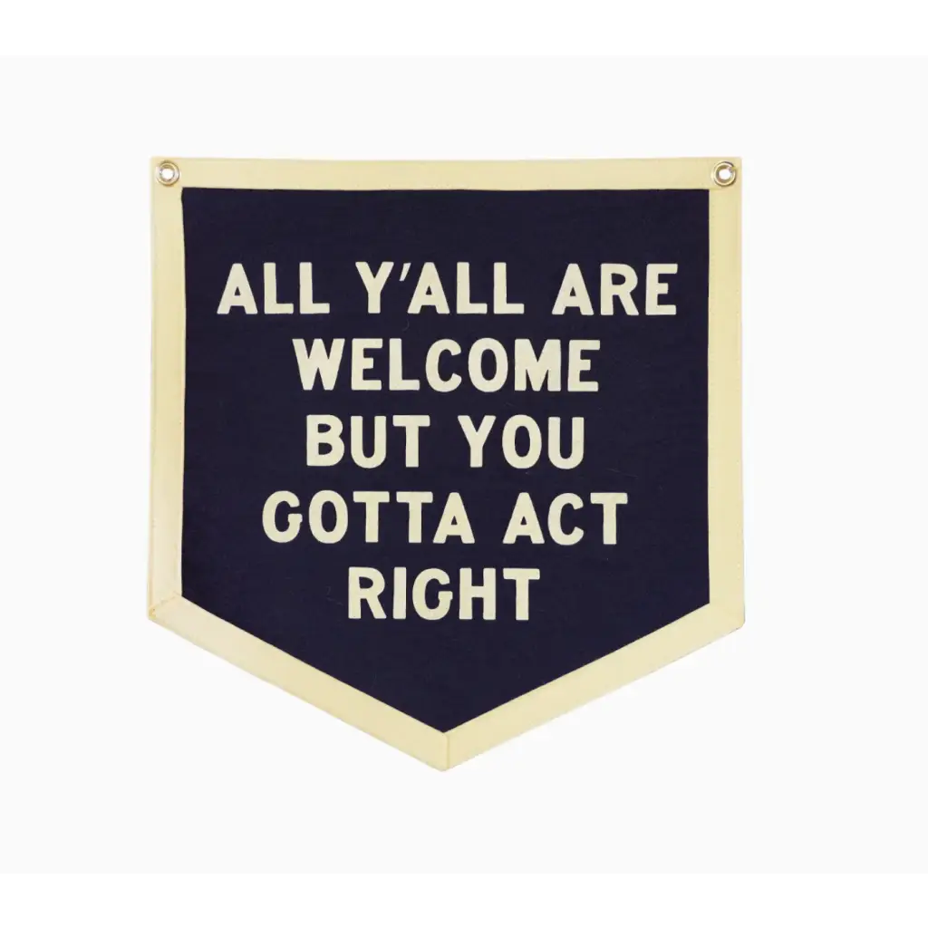 Navy blue pennant by Orleans Artist Dr. Bob, featuring welcoming text for all y’all