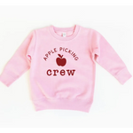 Pink crewneck sweatshirt with apple picking design, perfect for stylish moms and kids